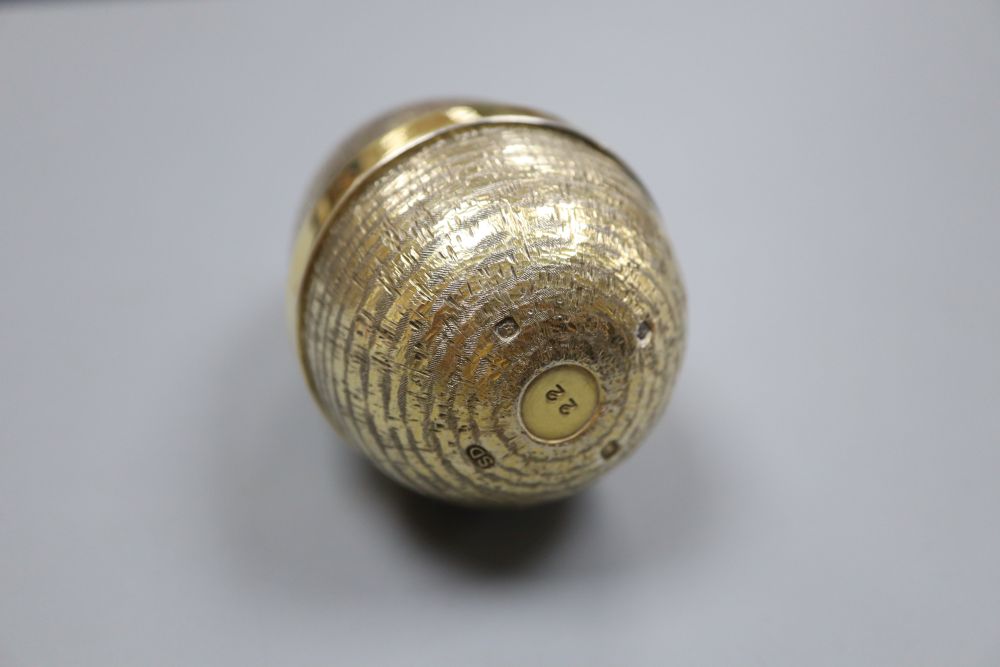A modern textured silver gilt surprise egg by Stuart Devlin, London, 1985, opening to reveal a marlin, 72mm, gross, 117 grams.